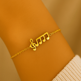 Bracelet note musicale doré en acier inoxydable porté au poignet